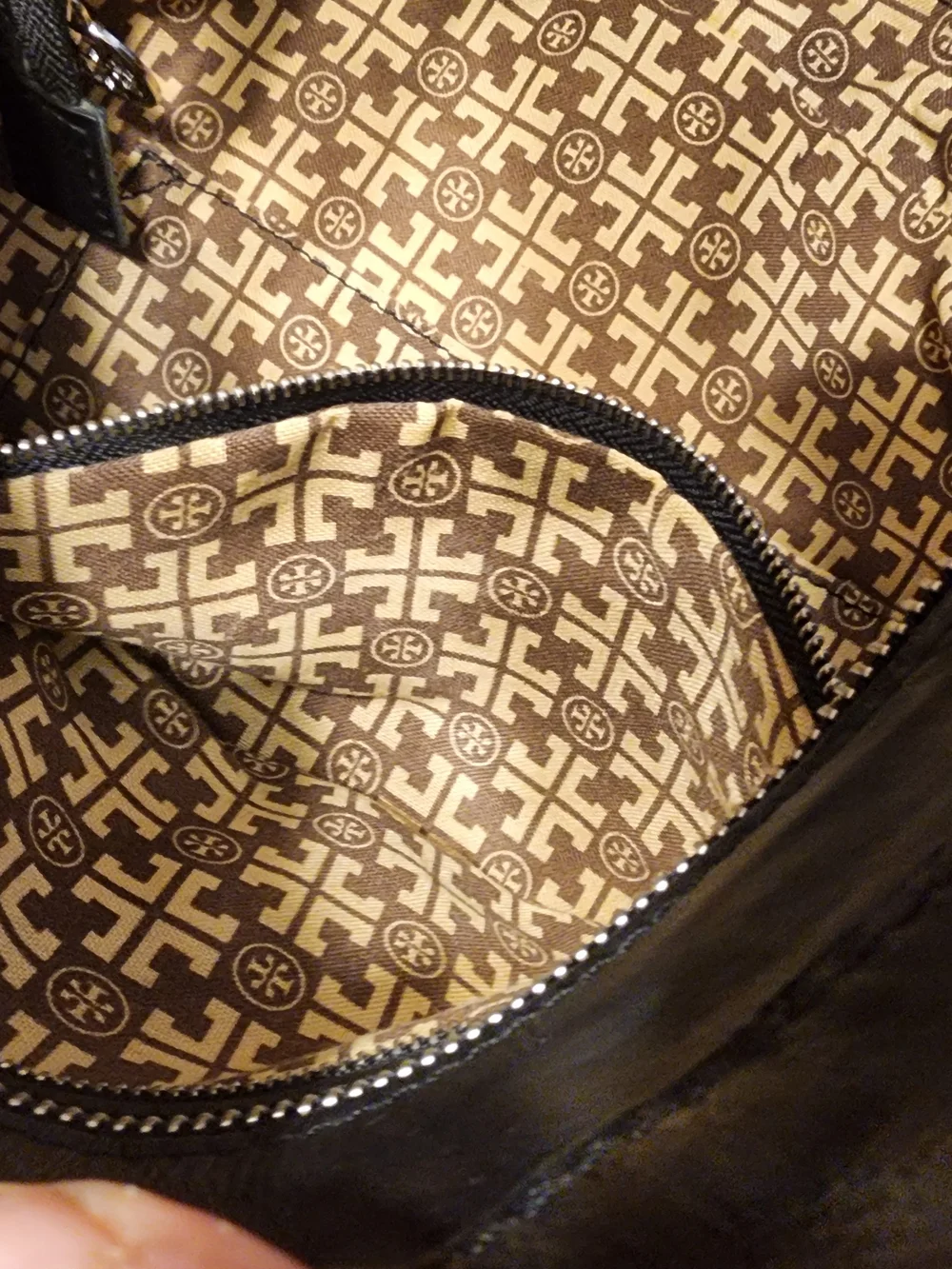 Tory Burch Classic Bombe tote handbag With embossed logo on a black leather Tote